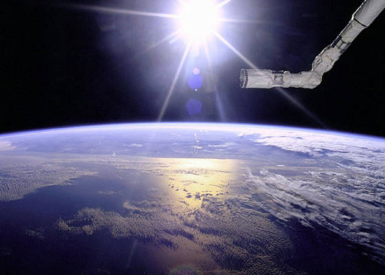 robot_arm_over_earth_with_sunburst_-_gpn-2000-001097.jpg